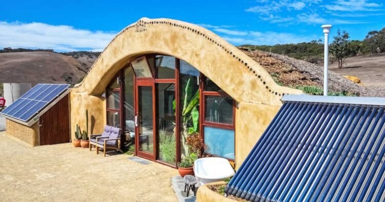 Man builds Earthship utilizing automobile tires and glass bottles