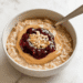 Peanut Butter and Jelly Protein Oatmeal [vegan + gluten-free] • Wholesome Helper